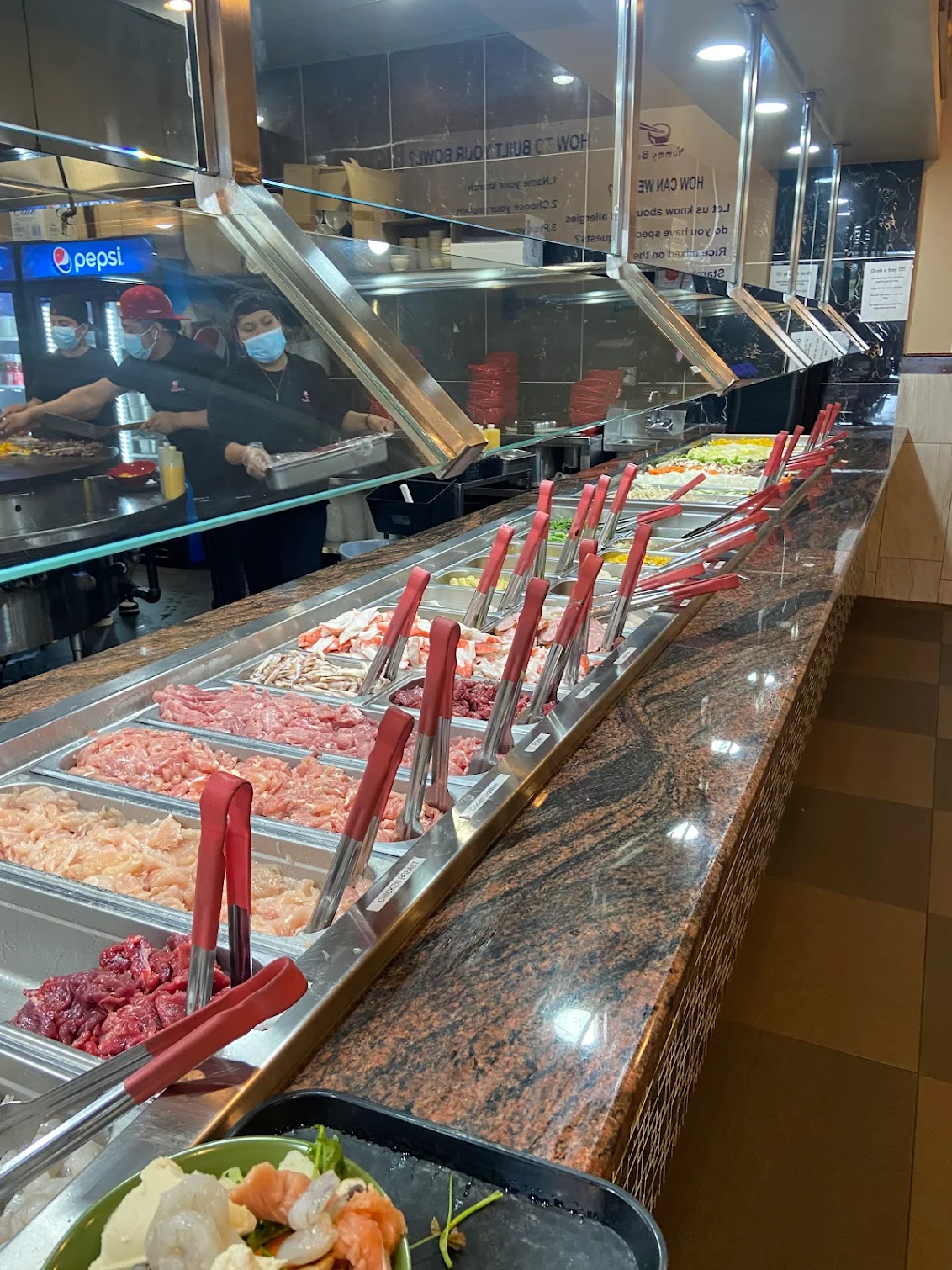 Fresh ingredient and sauce bar at Yummy Bowl